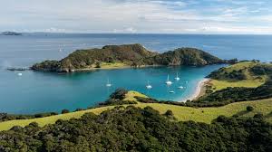 Yachts anchored in a turquoise bay among the islands of the Bay of Islands